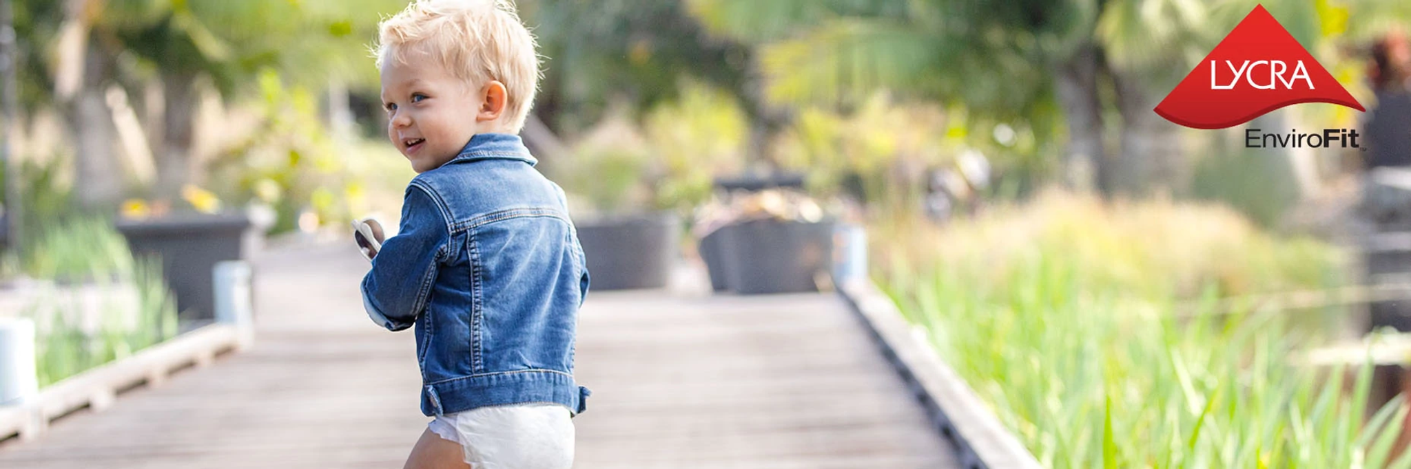 A baby in a diaper promotes the commercial launch of LYCRA EnviroFit™ fiber for nonwoven personal care products at INDEX™ 23