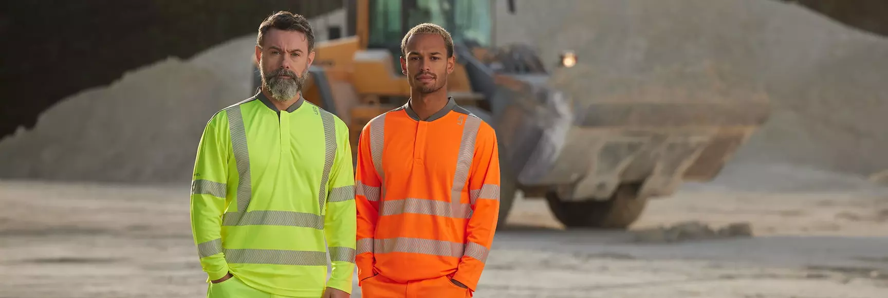 Two models wearing LEO workwear high visibility top and pants