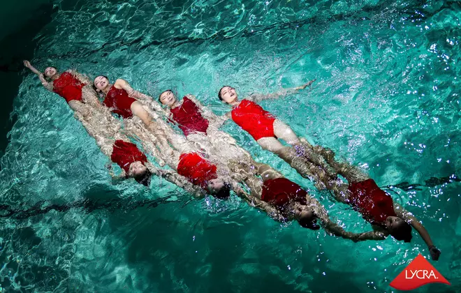 Synchronized swimmers wearing swimsuits with LYCRA® lastingFIT technology at The LYCRA Company’s annual consumer event.